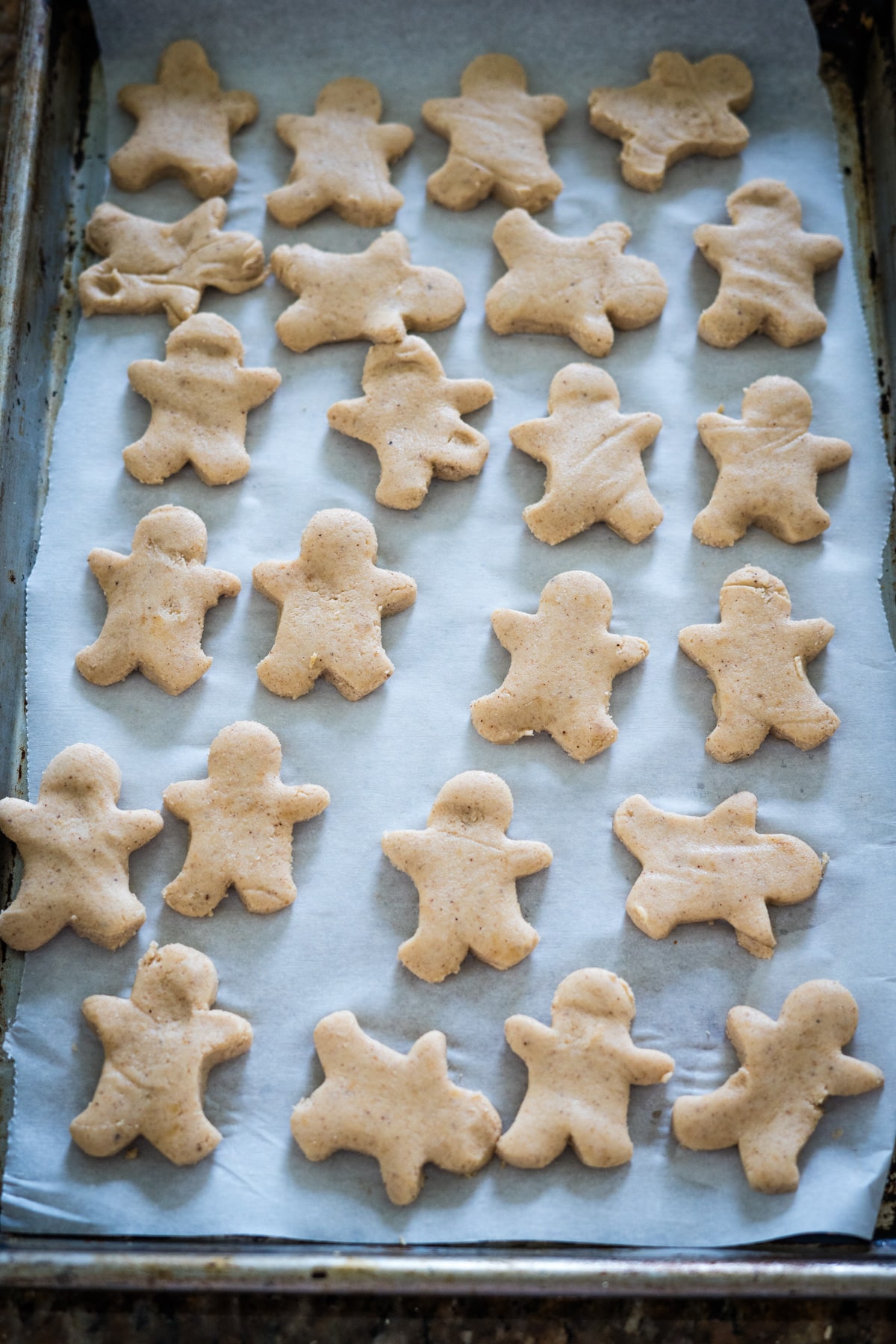 Gingerbread cookies on a baking sheet.