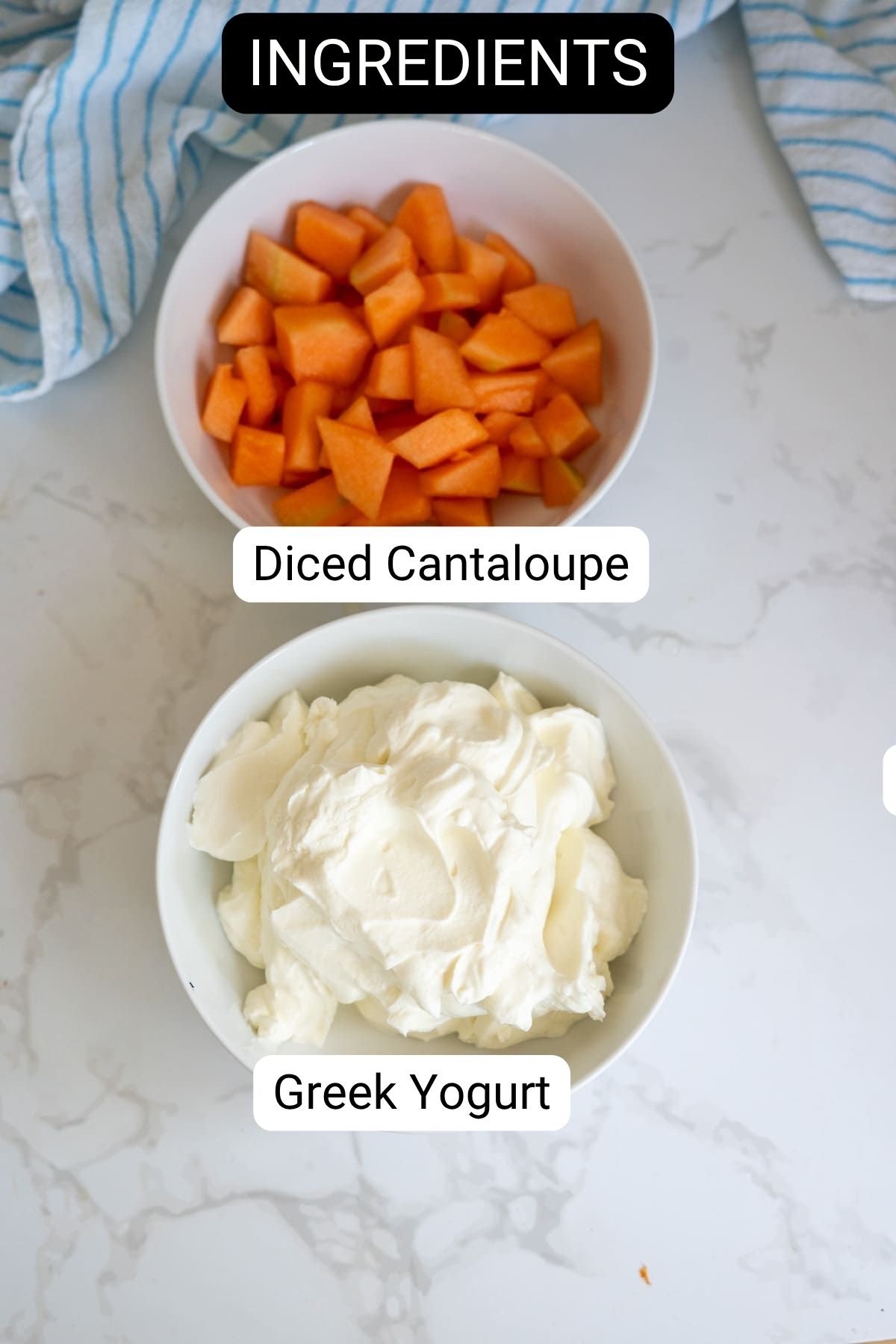 Two bowls on a marble surface: one containing diced cantaloupe, the other filled with Greek yoghurt. Labels identify each ingredient. A striped cloth is partially visible at the top.